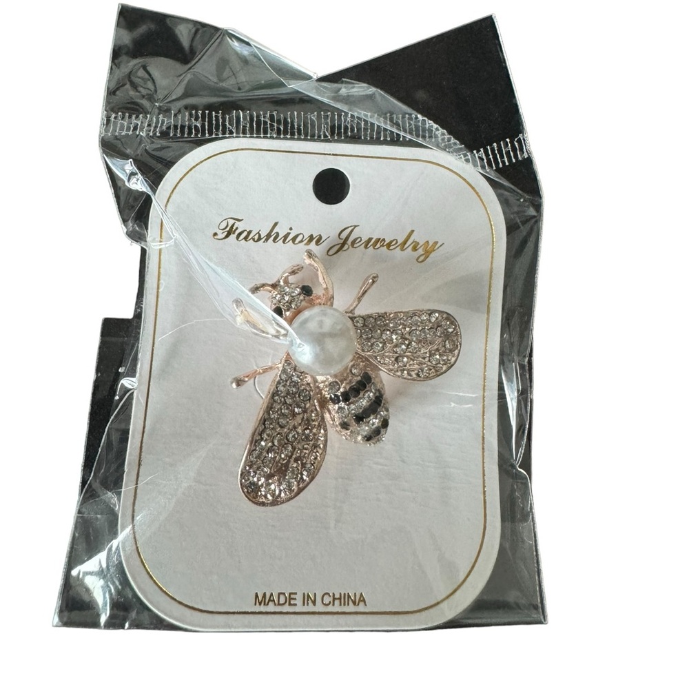 Gold bee brooch